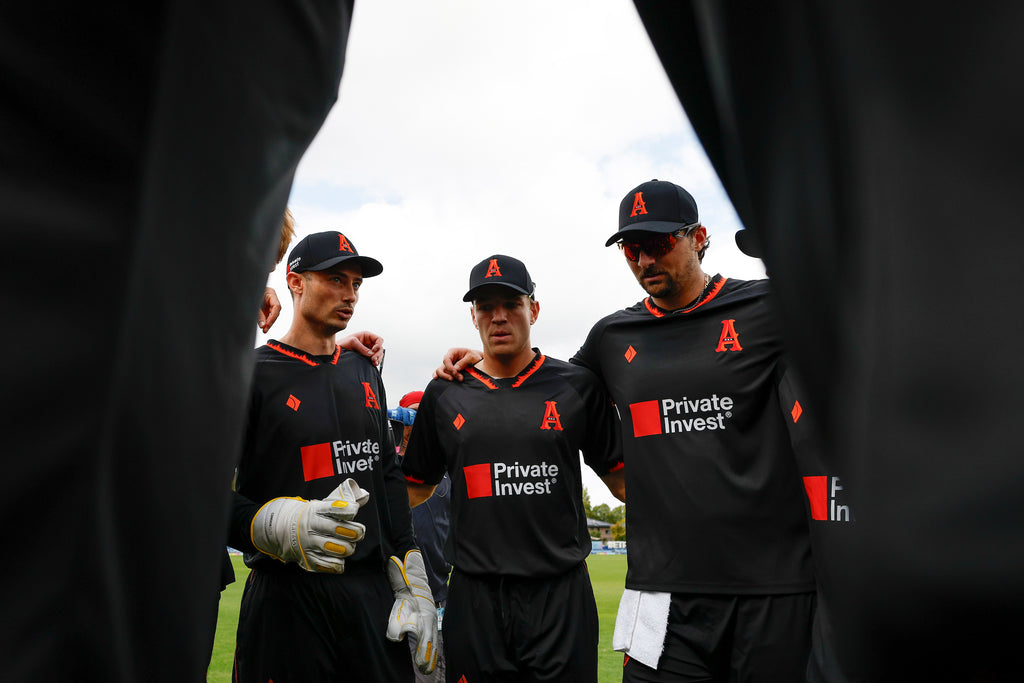 Amsterdam Flames players in a team huddle, close up